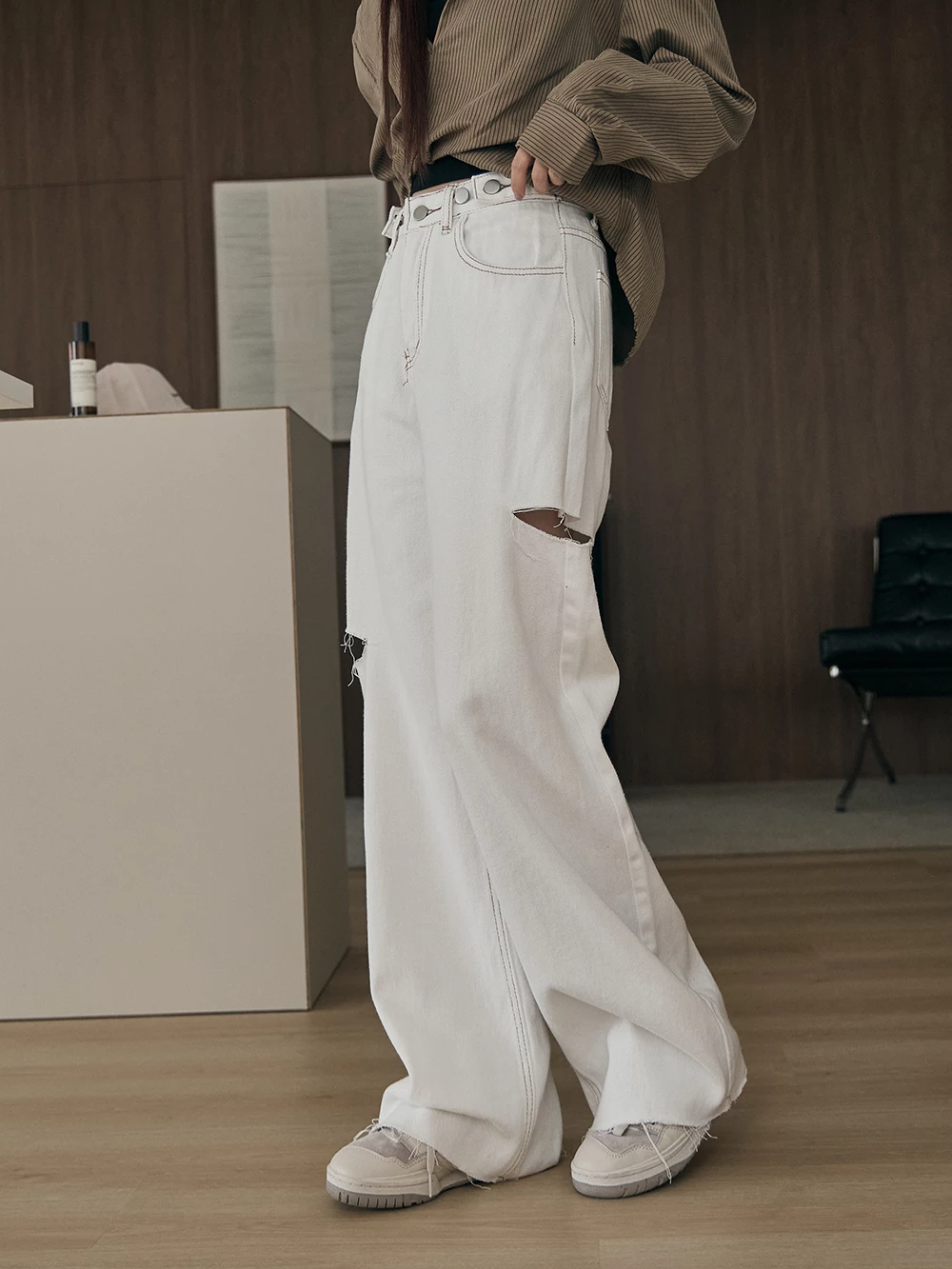 調節釦割破牛仔褲